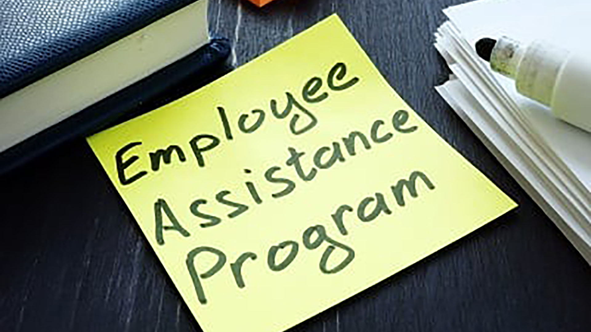 employee assistance program label on yellow pad paper